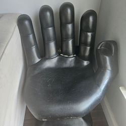 1970 black hand chair with cupholder.