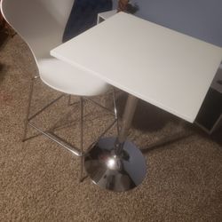 SLEEK SMALL SWIVEL ADJUSTABLE HIEGHT AND CHAIR ….WHITE AND CHROME …HAS SOME SCUFFS OTHERWISE IN GREAT CONDITION..