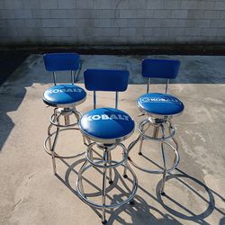 3 Kobalt swivel bar stools.