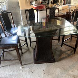 Glass top wooden dinner/patio table with 5 chairs (delivery available)