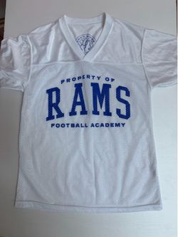 Boys ages 7-8. White Rams Football Academy jersey with blue text reading 'PROPERTY OF RAMS FOOTBALL ACADEMY' football academy