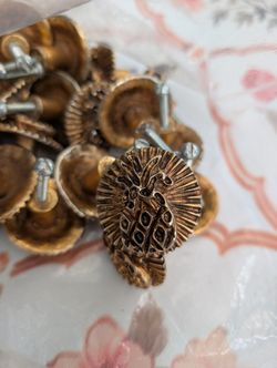 furniture handles have a gold tone with a relief image of a pineapple