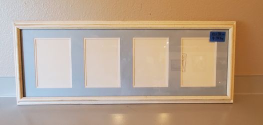 Frame antique white with blue matting 4- 5x7in opening