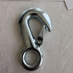 The item shown is a Roadmaster snap hook, typically used for safety cables on travel trailers or towed vehicles.  Model/Part Number: RM-910031. Weight
