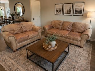 Brown leather sofa and love seat.