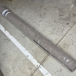 New area rug with corner cut off of it