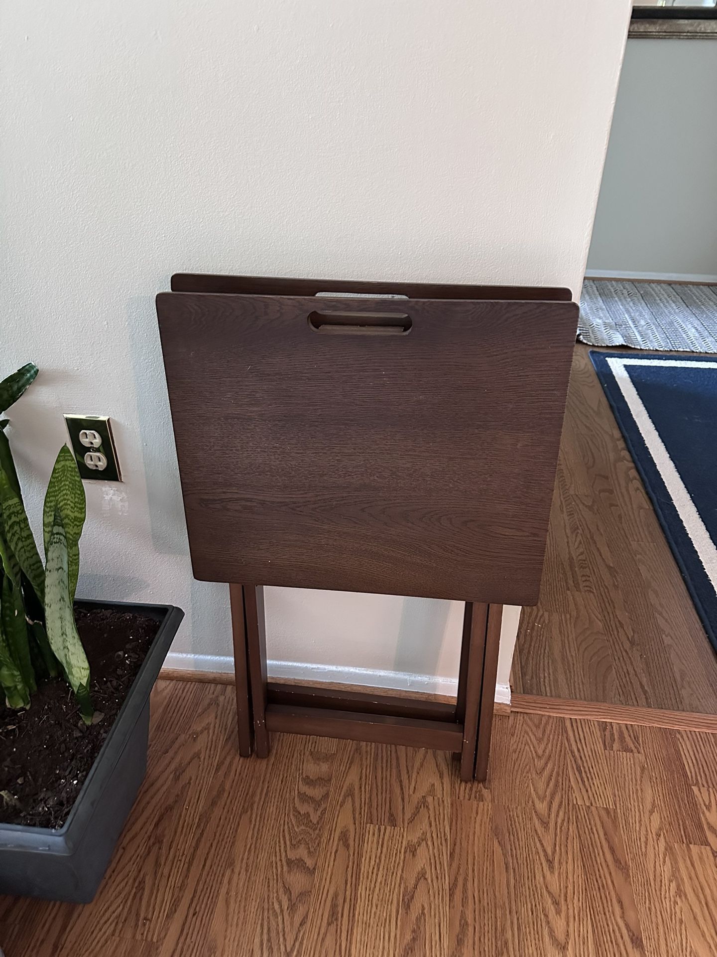 A Set Of Two Folding Eating Tables