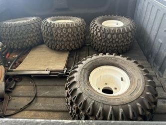 22x12-8, already mounted on white 5-lug steel rims.