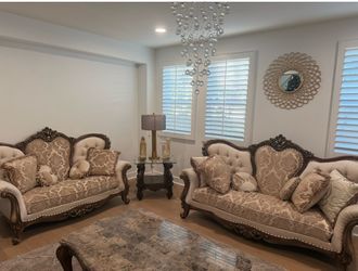 Two luxury sofas and table