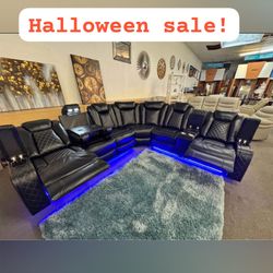 Black leather reclining sectional sofa with led light