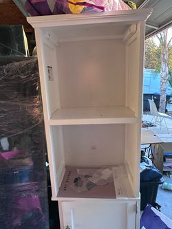 Tall double white storage cabinet
