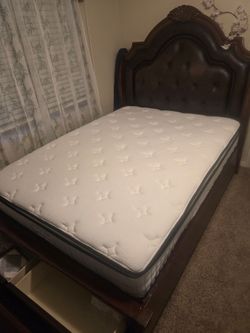 Queen bed with mattress, soft leather headboard.