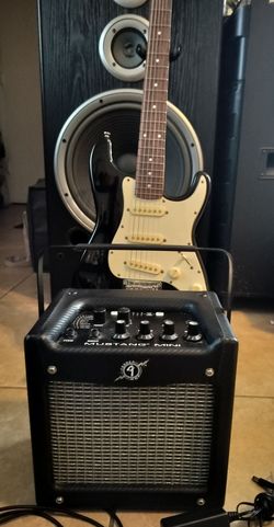 Squier by Fender electric guitar with Fender Mustang amp