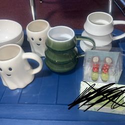 Lot of cups and bowls as well as salt and paper Shakers