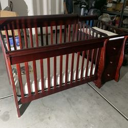 Crib with changing table, drawers and shelf attached