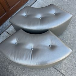 Two Matching Silver Ottomans