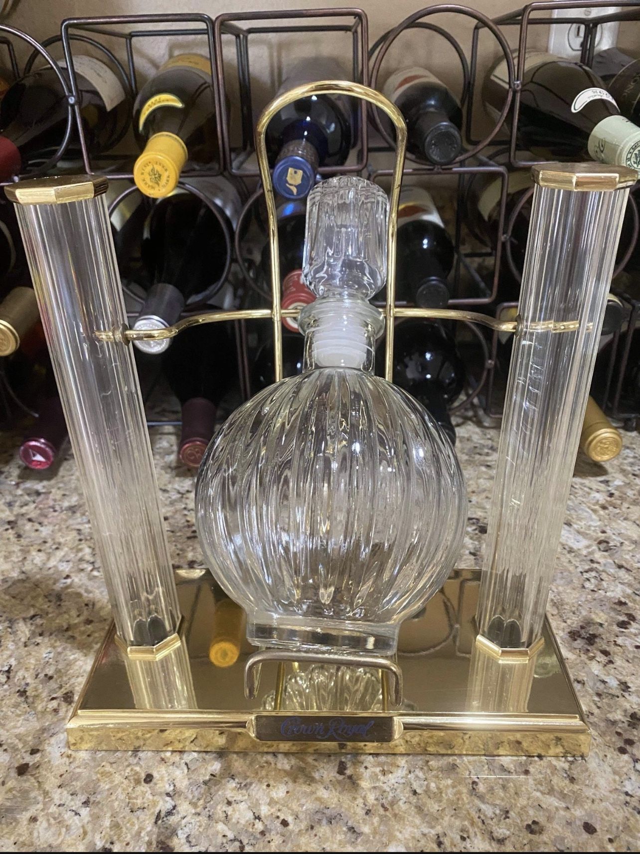 Crown royal display with empty bottle swing & pour cradle. Holder bar display