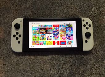 NINTENDO SWITCH with 100 Popular Switch Games Included