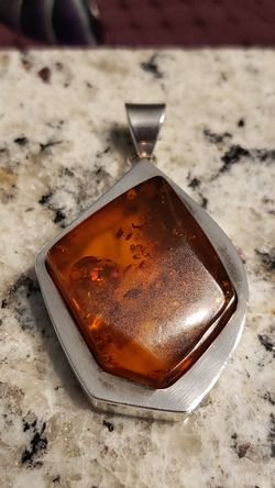 Amber stone pendant with sterling silver bezel and bail