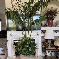 Faux Palms Surrounded By Smaller, Lush Foliage Artificial Evergreen Silk Plants In Decorative Urns.