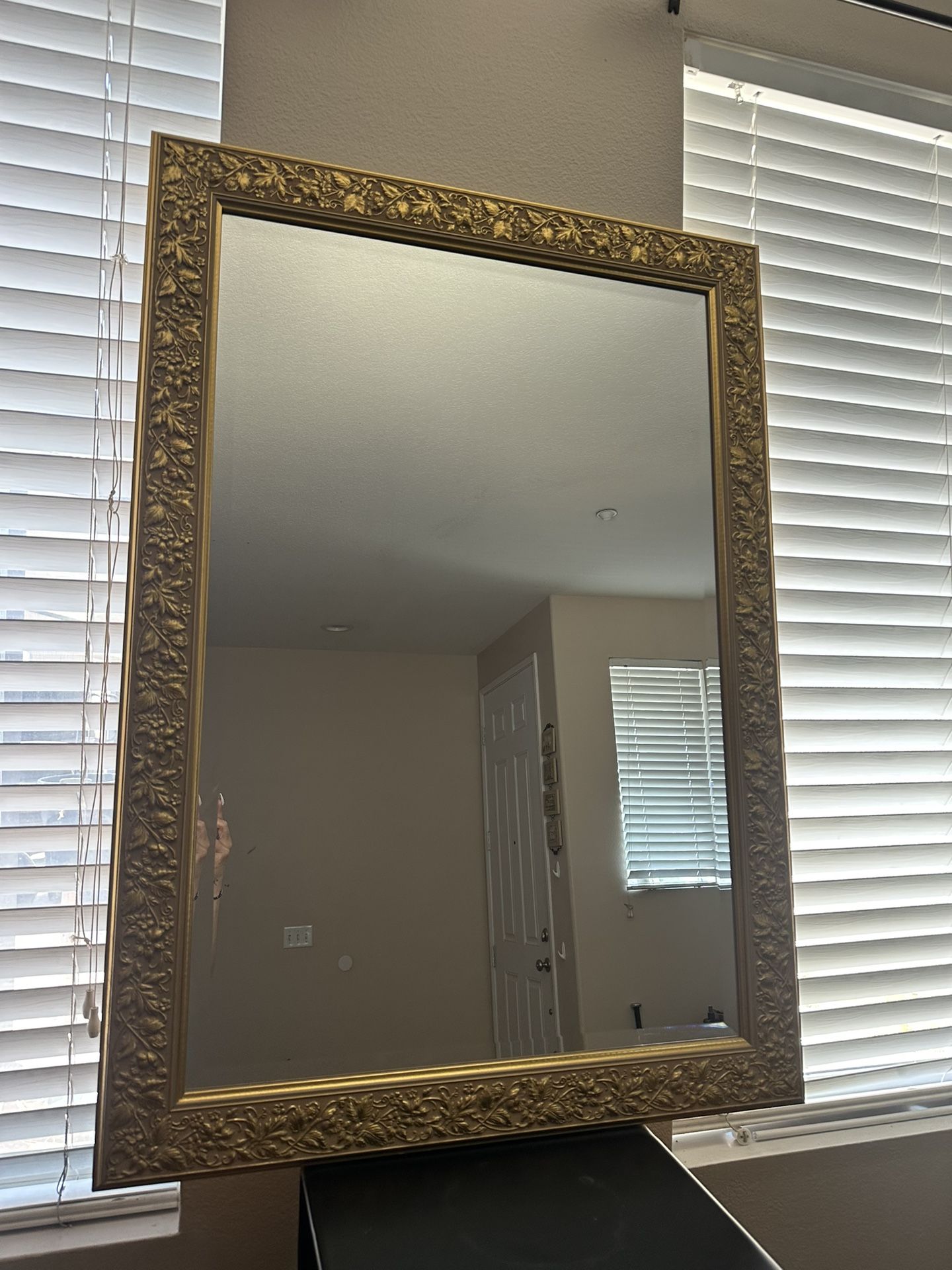 Gold trim wall mirror