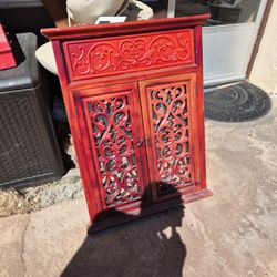 antique mahogany wood window mirror featuring intricate carved designs. 