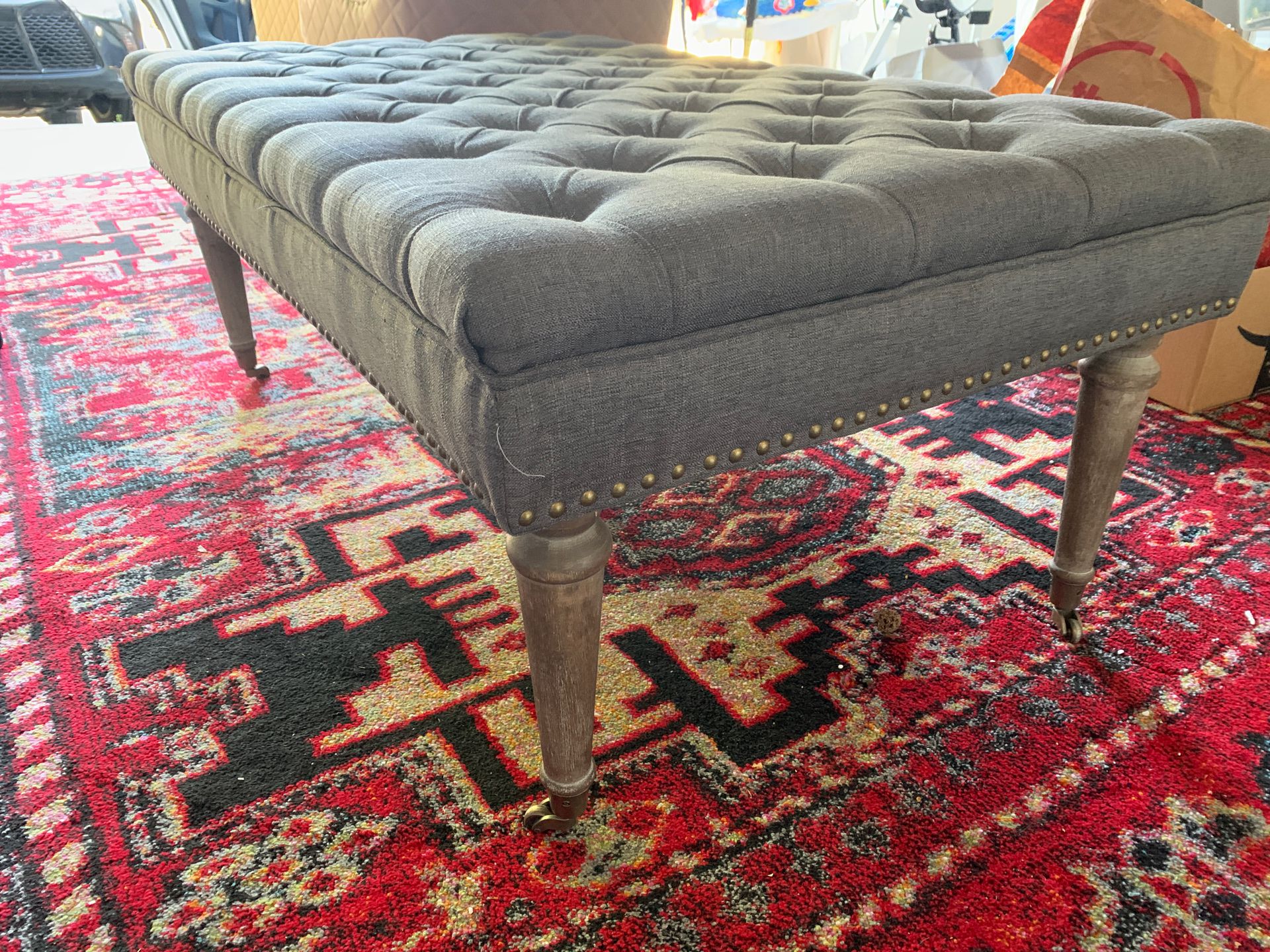 27.5 in by 47 inch length x 19 inch height tufted gray ottoman with wheels