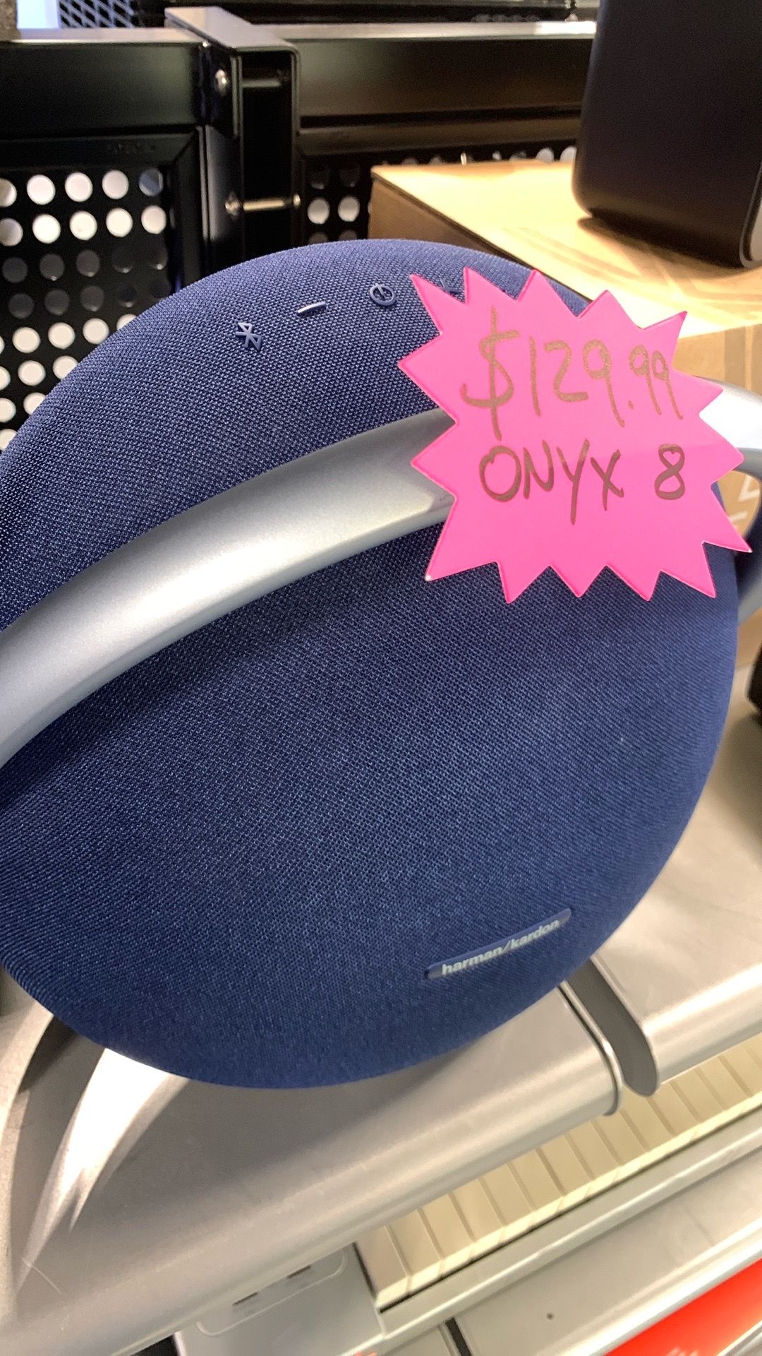 Harman Kardon Onyx Studio 8 Bluetooth speaker in blue.