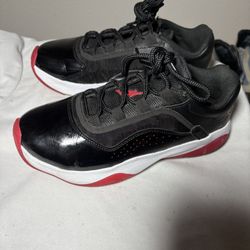 Black and red Jordan 11 Retro Low trainers