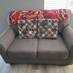Couch And Love Seat Set From Ashley Furniture. Like New. Grey With Pillows