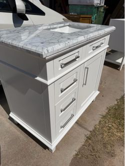 36” BATHROOM VANITY WITH SMALL DAMAGE INSIDE