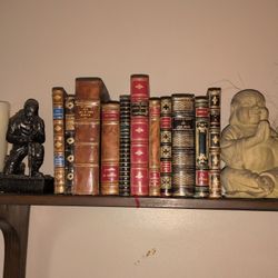 collection of antique, leather-bound books In Spanish