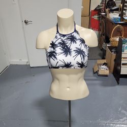 Stylish halter bikini top with palm tree print. Perfect for beach days.