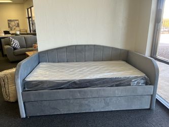 Grey velvet day bed with twin mattresses included