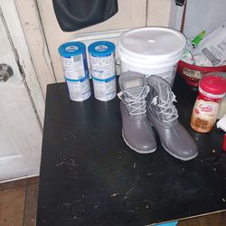 7 Bottles Of Baby Milk Powder And 8.5 Boots
