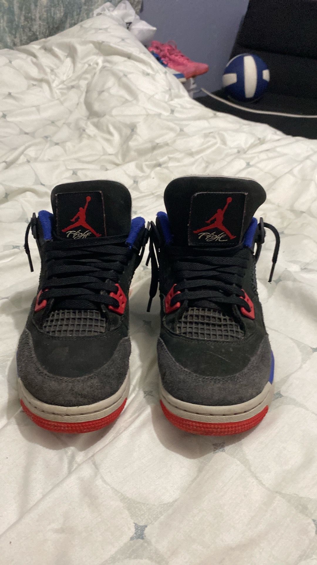It a Jordan 4s black blue red and gray and size 5