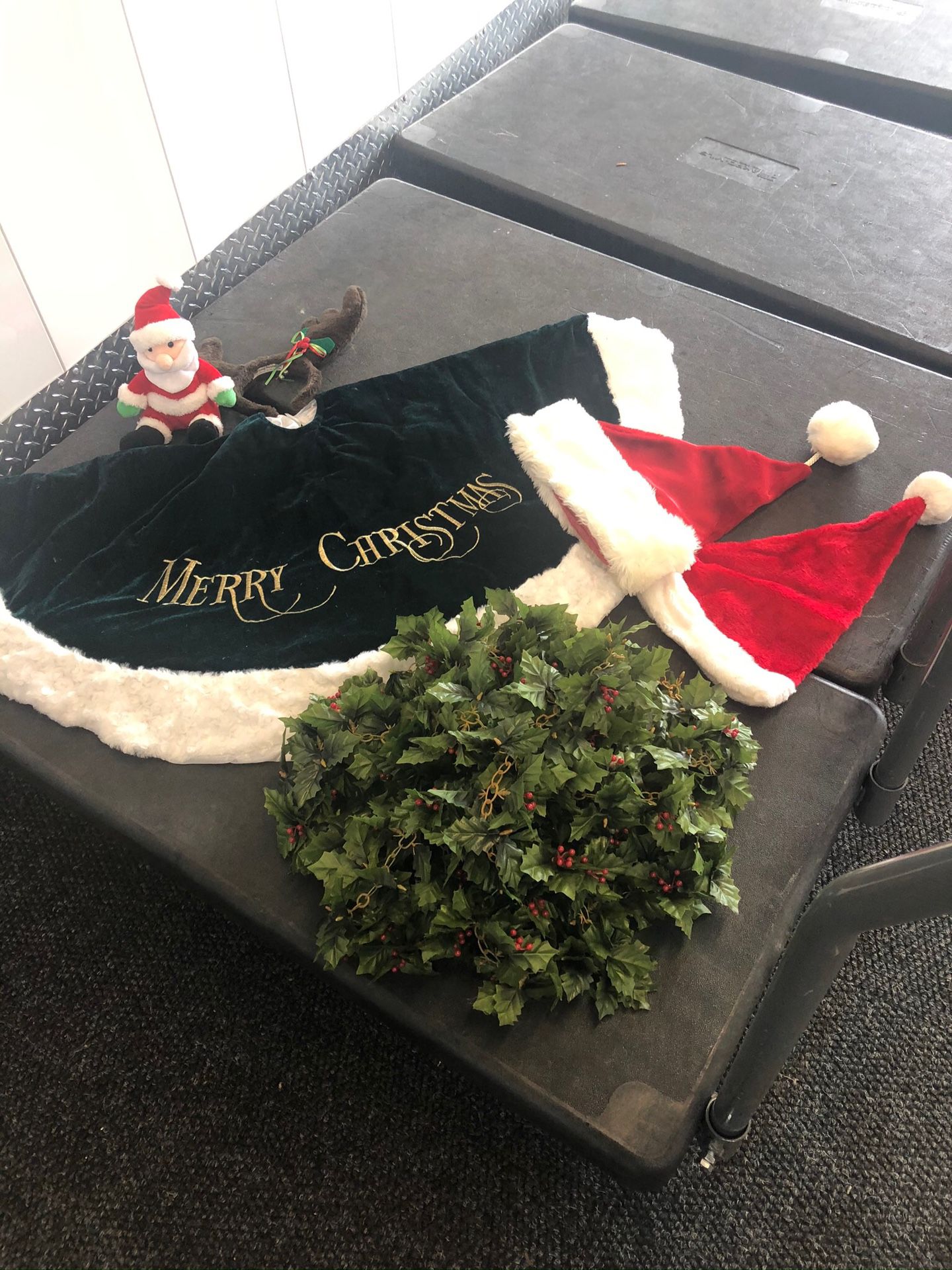 Christmas Items - Tree Skirt, Garland, Two Hats, Reindeer Antler Headpiece, and Stuffed Santa Toy