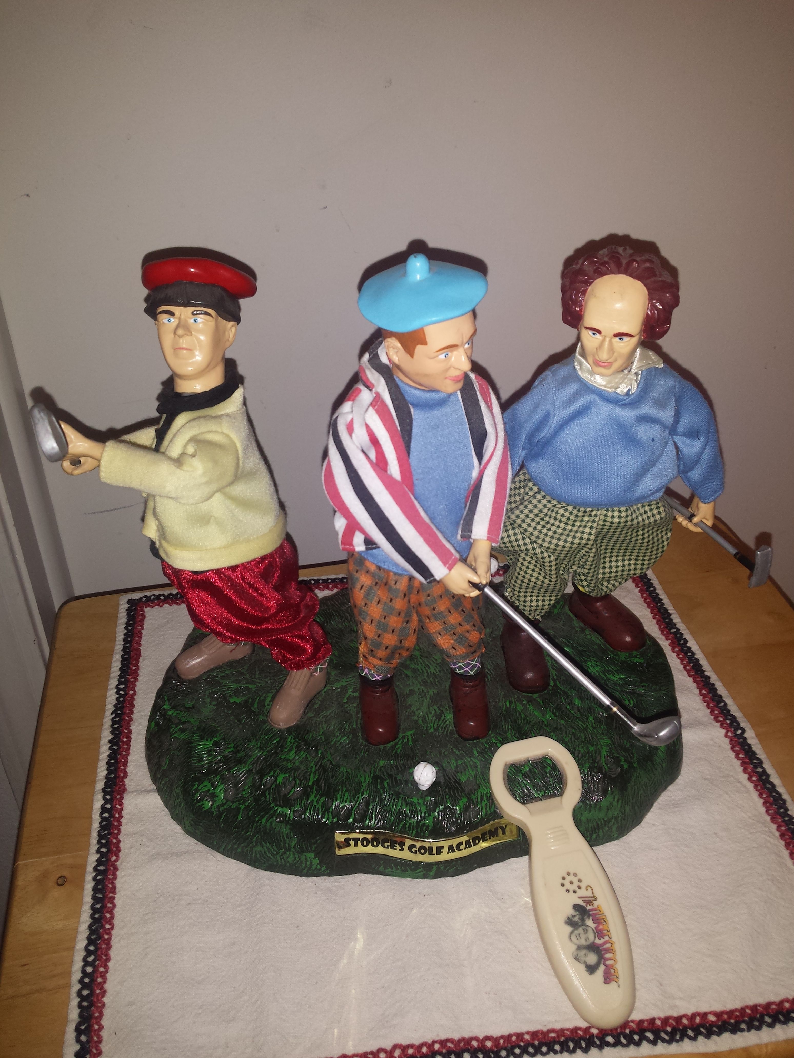 Three stooges golf academy also bottle opener.