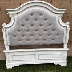 Realyn (FULL) bed frame chipped white w/beige upholstery head board.