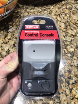 Motion activated garage door opener console