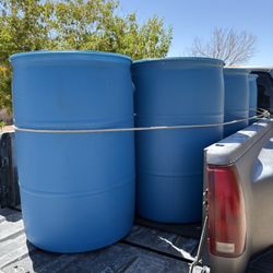 4 Left - New 55 Gallon Blue Plastic Barrels