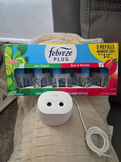 Febreze PLUG Scent Booster Continuous Scent Device Oil Diffuser & 5 refills.