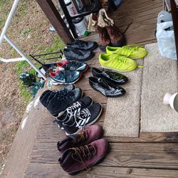 Seven pair of men's shoes, size 13 & one pair of Ugh boots along with roller carry bag
