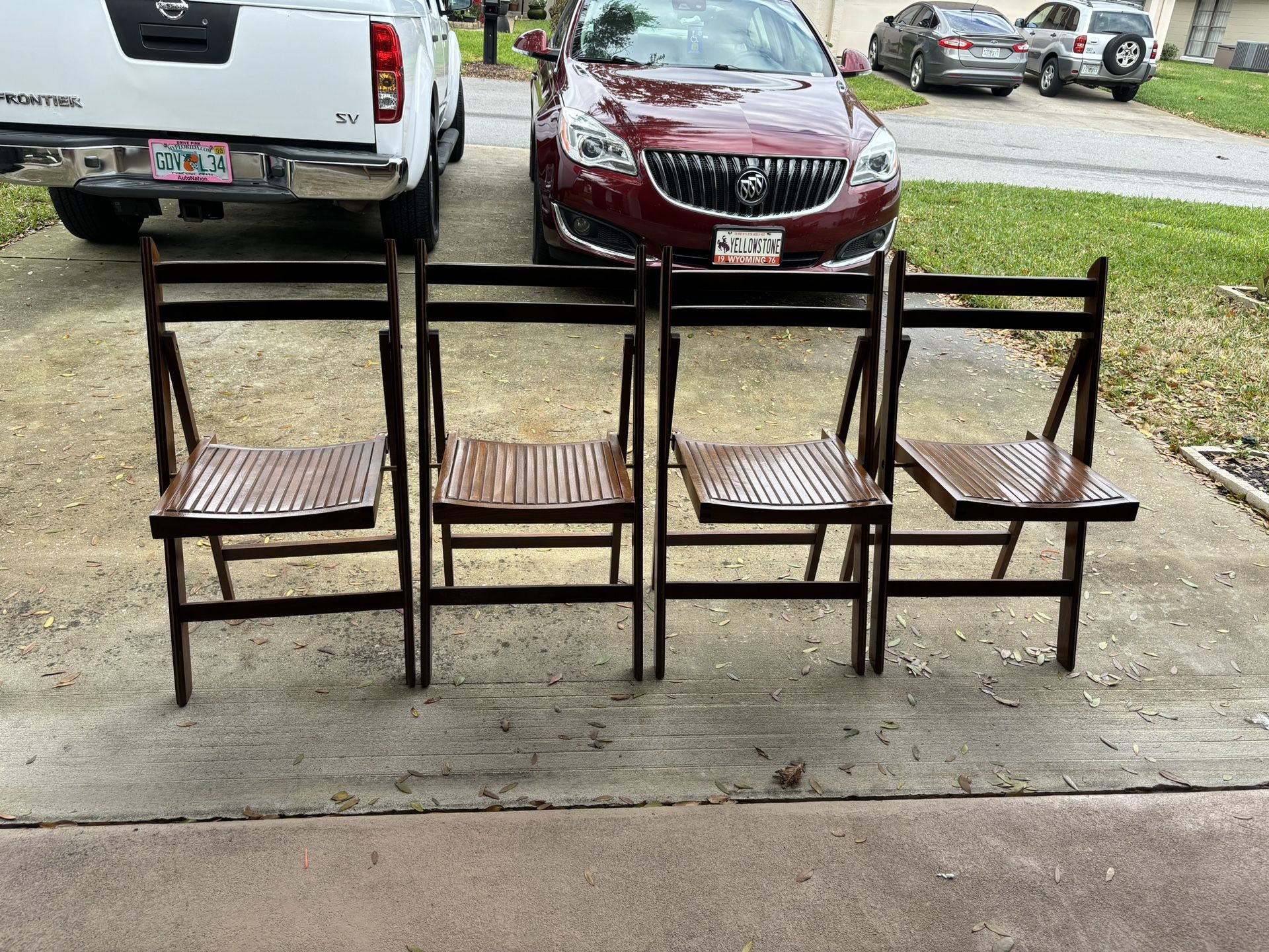 Four Wooden Folding Chairs made in Romania. Excellent condition.