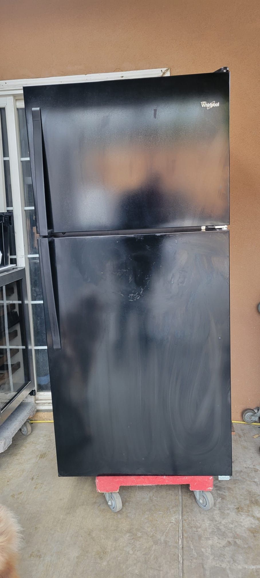 Whirlpool black refrigerator in good condition everything work good
