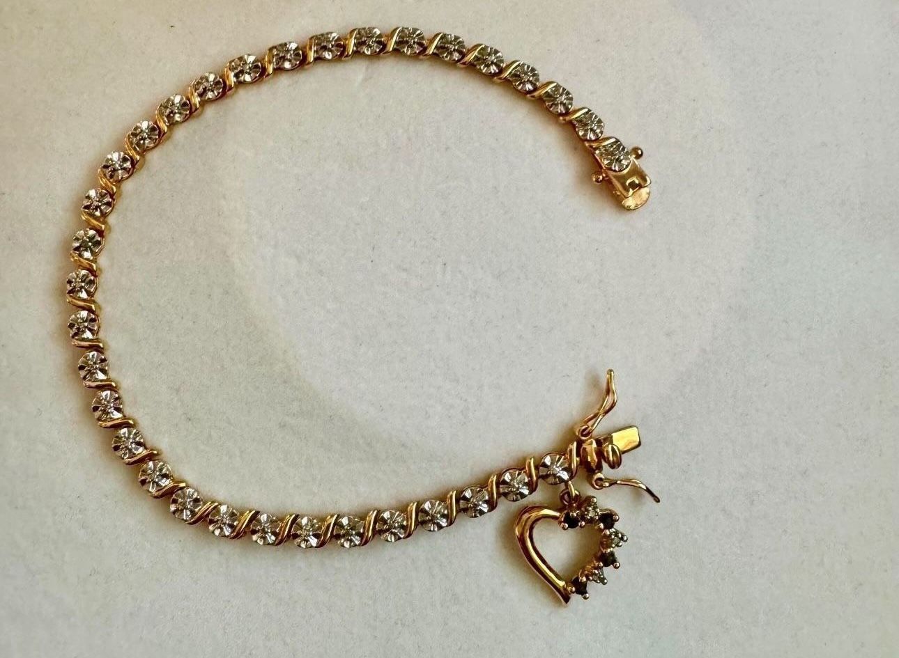 Vintage 925 sterling silver gold cubic zirconia tennis rhinestone bracelet with heart shaped charm Approx 7.75” length In great condition