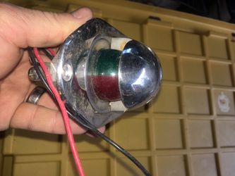 Fold away flush bow marine navigation light