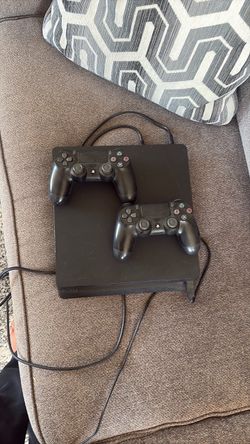 PlayStation 4 Slim Console with Two Controllers