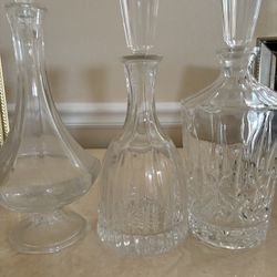 Three Crystal Alcohol Canisters For $40