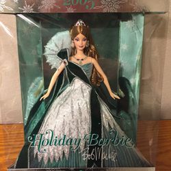 Collectible Holiday Barbie 2005 by famed designer to the stars, Bob Mackie.